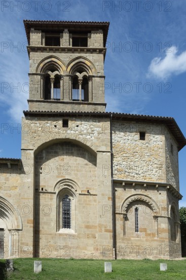 Mailhat village. Romanesque church with its square bell tower, Puy de Dome department,