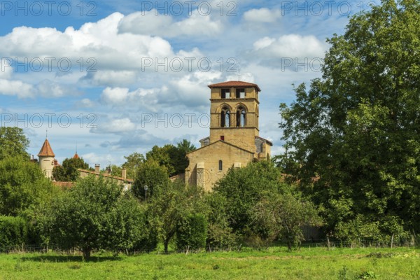 Mailhat village. Romanesque church with its square bell tower, Puy de Dome department,