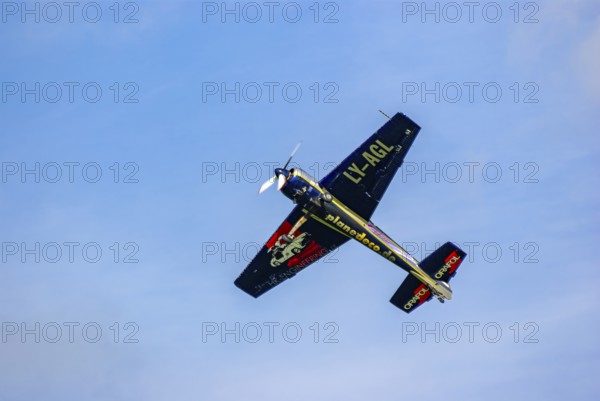 A Jakovlev Jak-55 with the registration LY-AGL during a flight demonstration as part of an air show