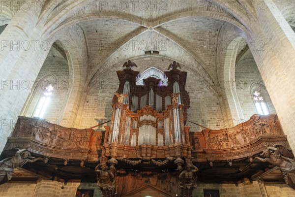Organ loft of Saint Robert abbey. La Chaise Dieu. Haute Loire department. Auvergne-Rhone-Alpes,