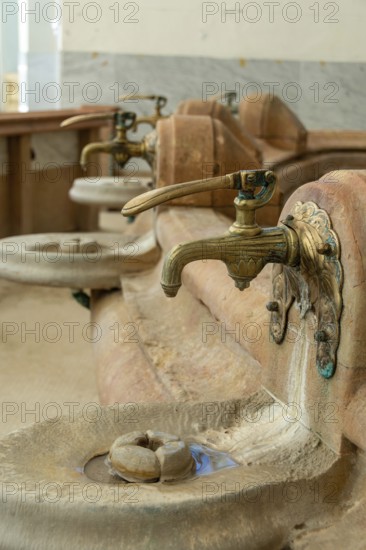 Vichy thermal city. Spring water taps in the Célesting spring (Source of Celestins), Allier