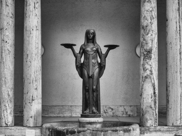 Statue, fountain figure The Tearful One, Goddess of Fate, funeral parlour, forest cemetery, black