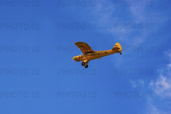 A Piper PA-18 Super Cub of the Bravo Lima Formation during a flight demonstration as part of an air