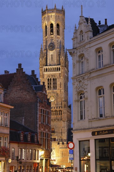 Illuminated Belfry in the historic city centre of Bruges in the evening light, Belfort on the Grote