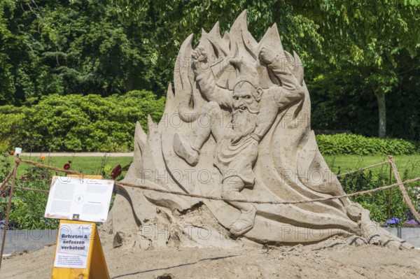 Sand sculpture with barrier, fairytale figure of Rumpelstiltskin, garden show, Bad Lippspringe,