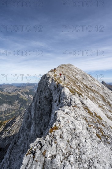 Mountaineer on the ridge of the Gamsjoch, transition to the main summit of the Gamsjoch, in autumn,
