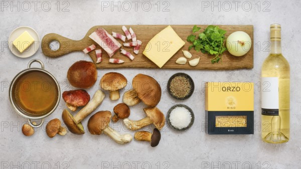 Fresh ingredients for a tasty risoni dish with porcini mushrooms are beautifully arranged on a