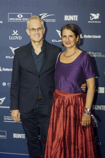 Norbert Ghafouri and guest on the red carpet in front of the award ceremony at Pullmann Berlin