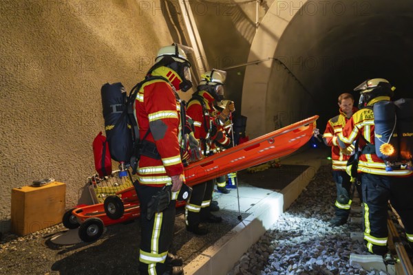 Firefighters prepare rescue in the tunnel with stretcher, firefighting exercise in the new tunnel