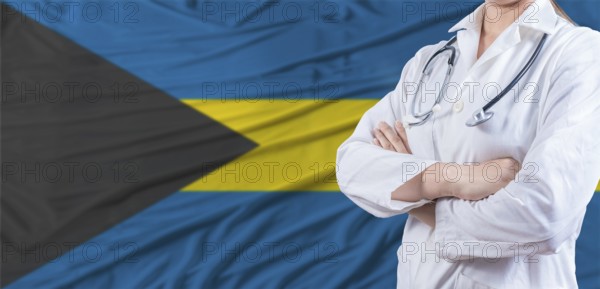 Doctor with crossed arms on Bahamas flag. Bahamas health and care concept. Female doctor on Bahamas