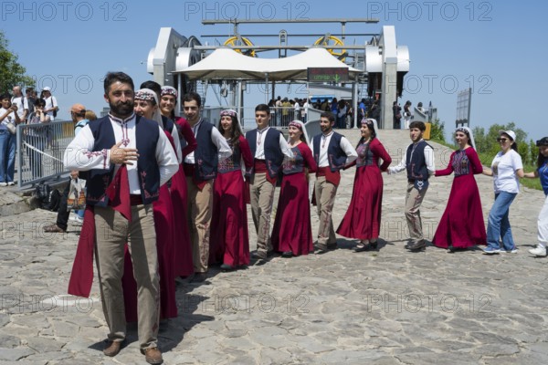 Group in traditional costumes at a festive gathering, folklore, Tatev, Tatev, Syunik province,