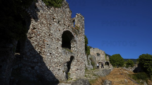 Ancient stone ruins with arches and shadows along a path with a flight of steps, Mystras, Mistra,