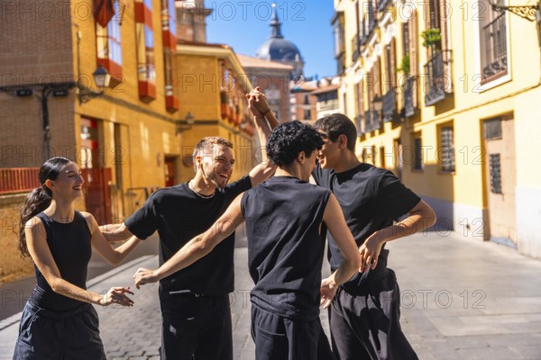 Group of young friends enjoying an urban contemporary dance performance, expressing joy and freedom