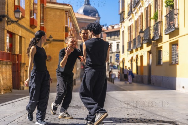 Group of diverse youth smiling, expressing joy and freedom while performing a contemporary dance
