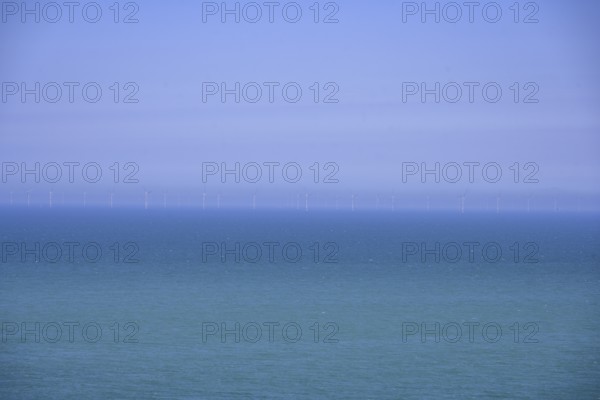 Wind turbines on the sea, hike from Yport to Etretat along the chalk cliff coast, Seine-Maritime