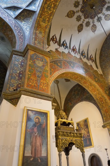 Magnificent church architecture with ornate paintings and decorations on the walls, Inside the