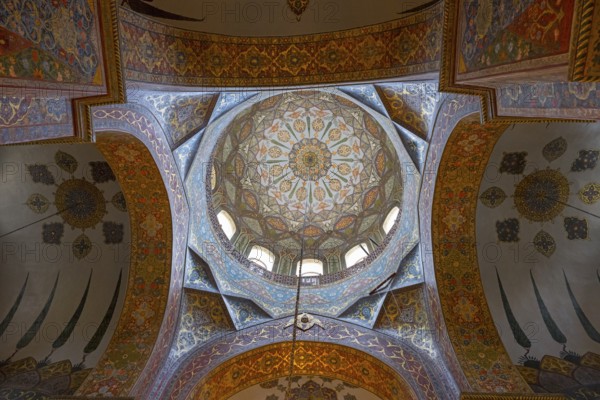 Detailed dome-shaped ceiling painting with elaborate ornaments and warm colours, Inside the
