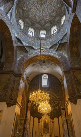 Elaborately decorated church dome with a large chandelier and artistic details, Inside the