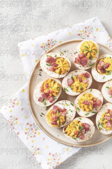 Spicy, stuffed ramen eggs, with bacon and green onions, homemade, no people