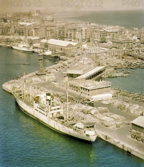 View from cable car of cargo ship 'Fylgia' in port, view to Barceloneta area, city of Barcelona,
