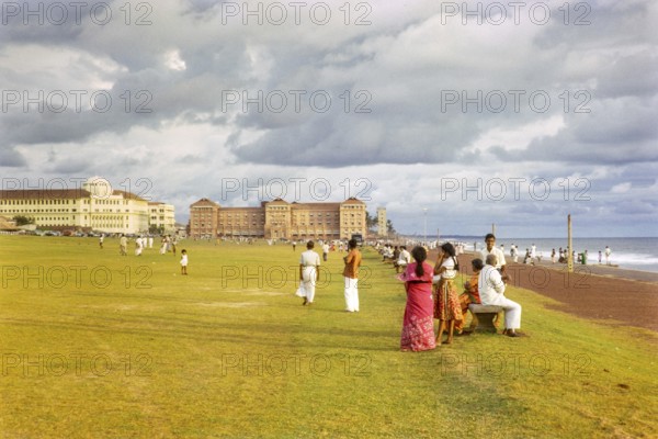 People enjoying leisure activities by the ocean, Galle Face Green, Colombo, Sri Lanka, South Asia,