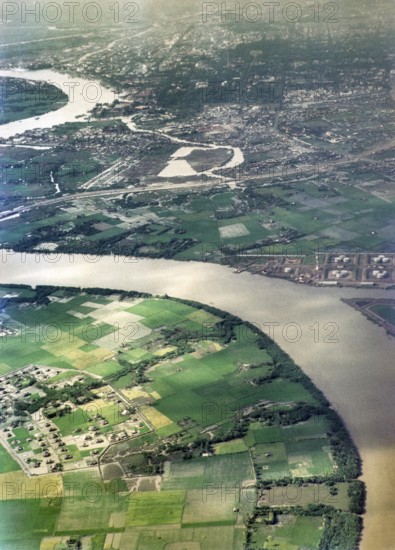 Captioned as 'aerial photo Saigon', meandering river in flat agricultural landscape of paddy