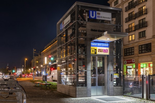 Night photo, long exposure with motion blur, modern lift at Unter den Linden underground station,