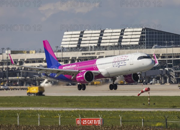 Flight operations at Stuttgart Airport with terminal. Aircraft on landing. Aircraft registration