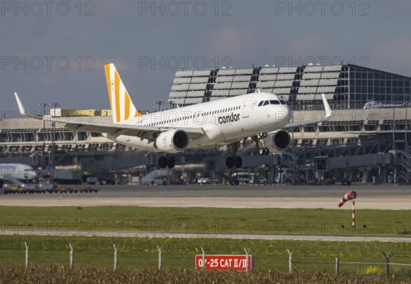 Flight operations at Stuttgart Airport with terminal. Aircraft on landing. Aircraft registration