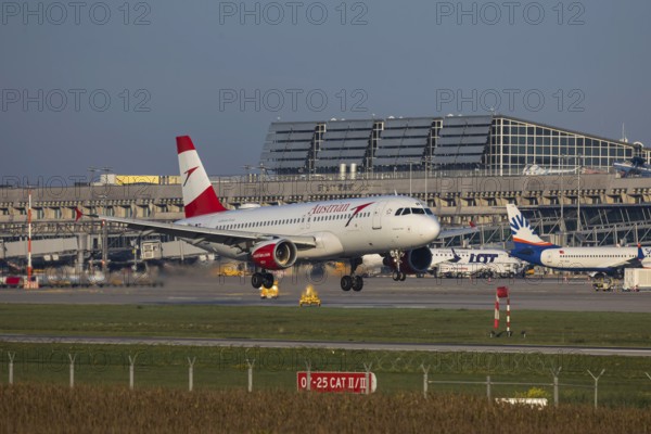 Flight operations at Stuttgart Airport with terminal. Aircraft landing. Aircraft registration: