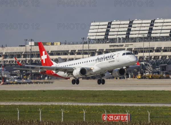 Flight operations at Stuttgart Airport with terminal. Aircraft on landing. Aircraft registration