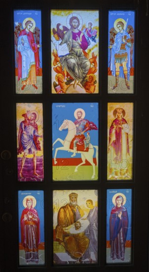 Stained glass window with detailed images of saints in bright colours, Dashtadem Fortress, Qagheni