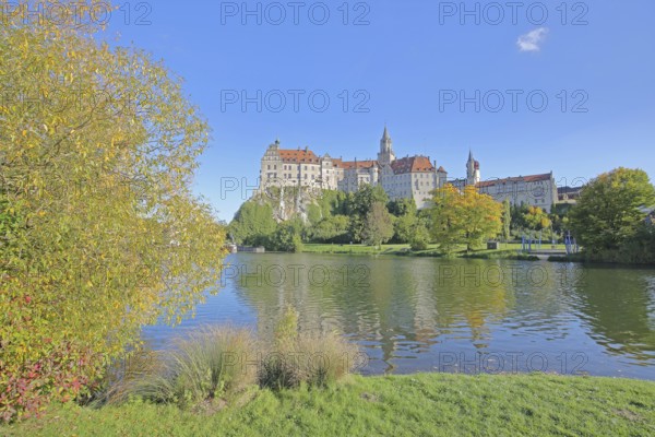 Hohenzollern Castle and Danube, river bank with autumn colours, landmark, castle, Sigmaringen,