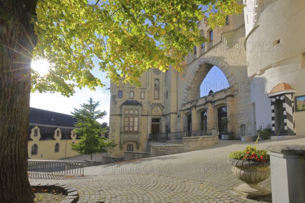 Entrance with portal and backlight to the castle, archway, guardhouse, landmark, mood lighting,