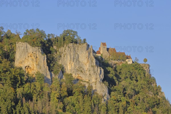 Werenwag Castle on the mountain with rock formations, cliffs, forest, landscape, light mood,