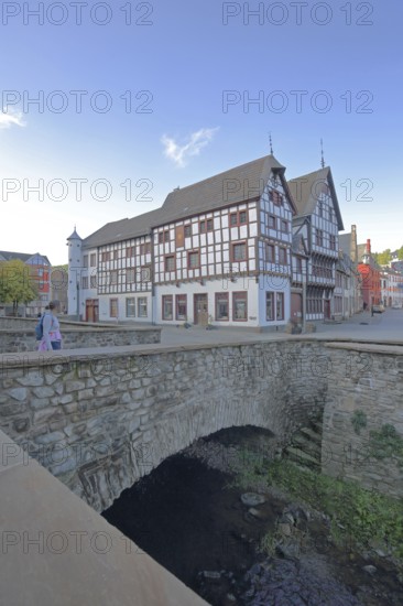 Heinz-Küpper-Bridge over the Erft stream and half-timbered house, pedestrian, stone arch bridge,