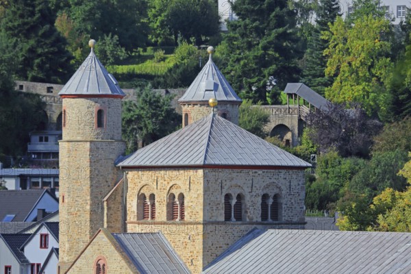 Twin towers of the Romanesque collegiate church of St Chrysanthus and Daria and historic town wall,