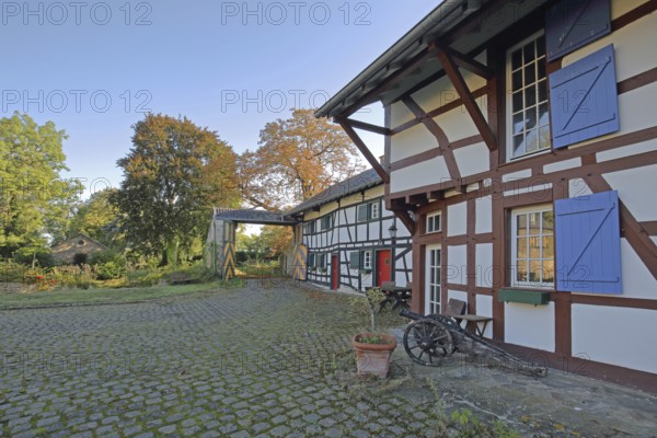 Half-timbered house with colourful shutters and entrance, built 14th century, inner courtyard,