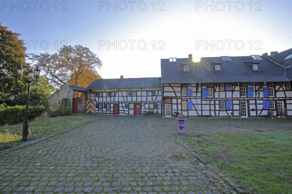 Half-timbered house in the inner courtyard of the Kleeburg castle built in the 14th century, moated