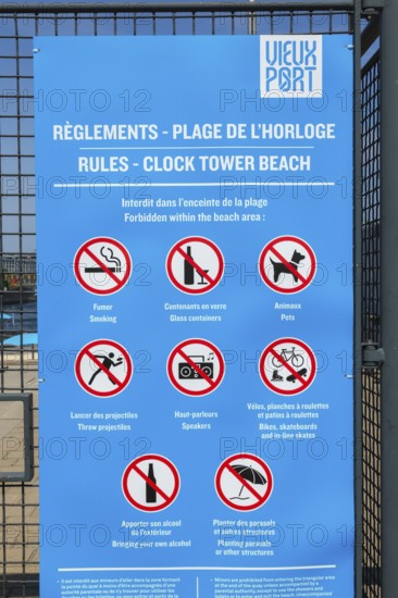 Posted rules sign with pictograms showing various restrictions at Clock Tower Beach, Old Port of