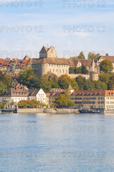 Castle and historic buildings on the lake, hills and autumn colours, Meersburg, Lake Constance,