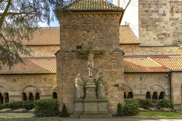 Inner courtyard with crucifix and cloister of St Peter's Cathedral in Osnabrück, Lower Saxony,