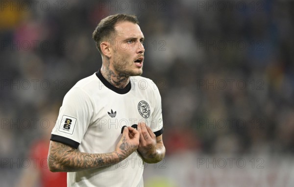 David Raum GER (22) mimes innocent lamb after foul gesture World Cup qualifier, international