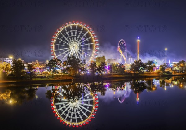 Folk festival in Stuttgart. Night shot with light effects. The 178th Cannstatter Volksfest on the