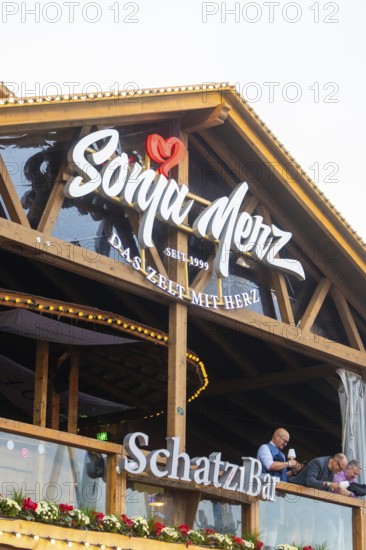 Wooden balcony with lettering in the evening mood and festive lighting, Cannstatter Wasen folk