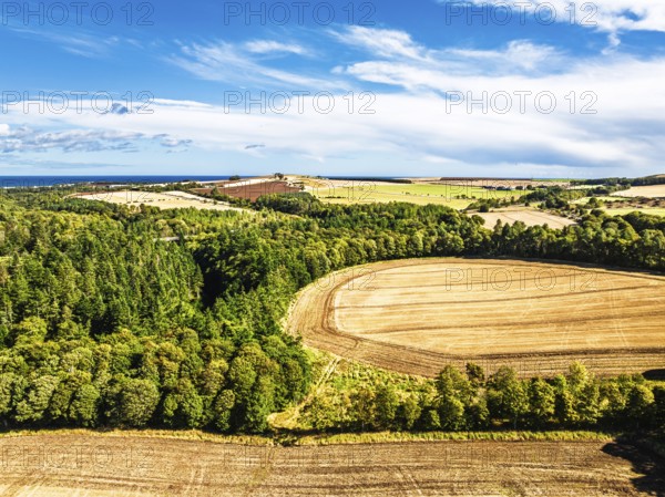 Farms and Fields over Ayton Castle from a drone, Ayton, Eyemouth, Scottish Borders, Scotland, UK