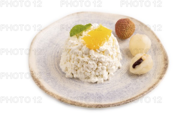 White ?ottage cheese, Curd, with orange and lychee isolated on white background, side view, close