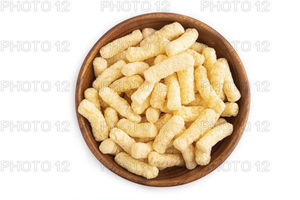 Corn flakes sticks with caramel in wooden bowl isolated on white background. top view, flat lay,