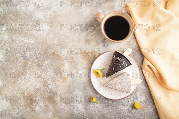 Chocolate and Vanilla Cake pops Marshmallow with cup of coffee on brown concrete background and
