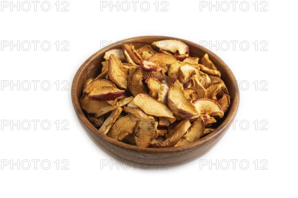 Dried Apples in wooden bowl isolated on white background. Side view, close up, healthy food,